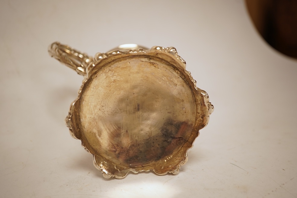 A Victorian embossed silver christening mug, of waisted form, by John Keith, London, 1851, height 10.2cm, 5.8oz.